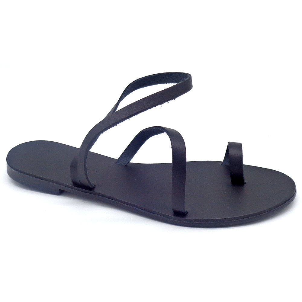 Black sandal with a single strap on a white background