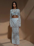 Woman wearing a light blue lace outfit against a beige background