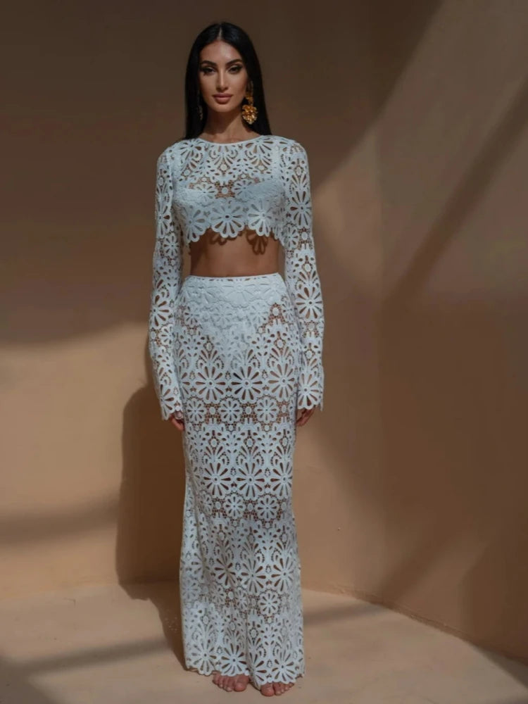 Woman wearing a light blue lace outfit against a beige background