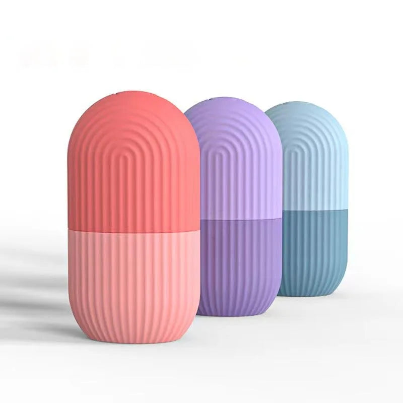Three cylindrical containers with ribbed texture in pink, purple, and blue on a white background