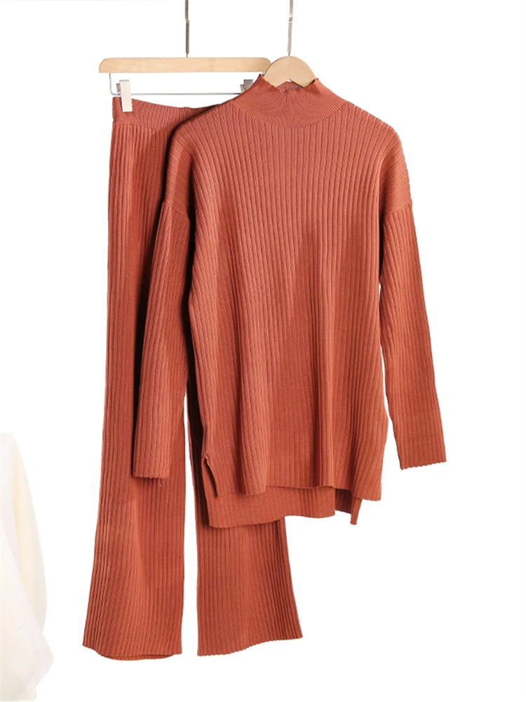 Brown ribbed knit outfit on a hanger against a white background