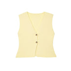 Yellow sleeveless top with buttons on a white background