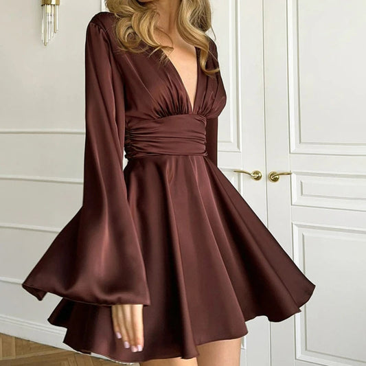 Brown dress with long sleeves on a white background