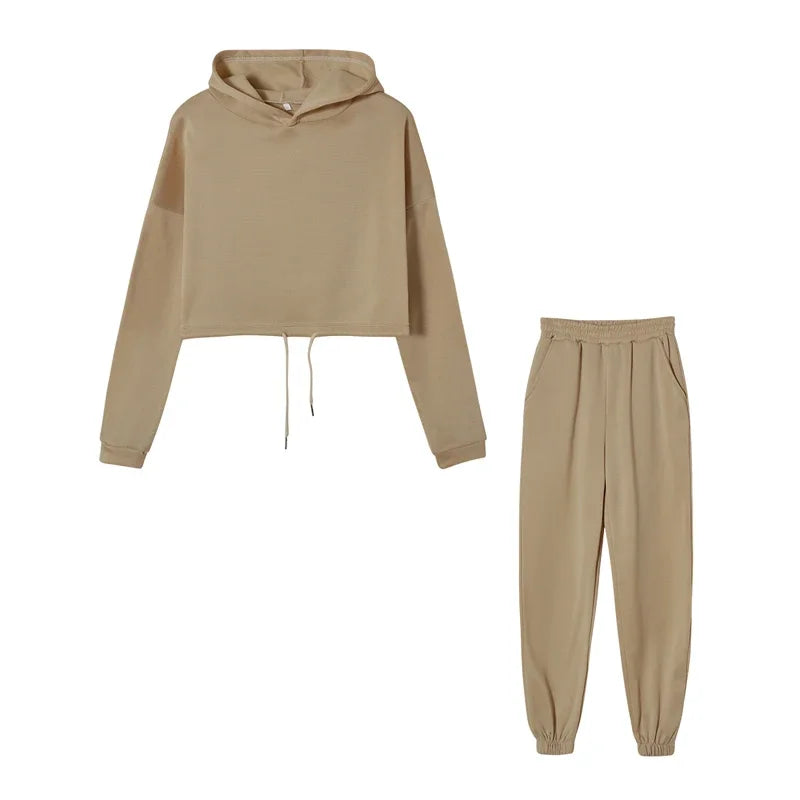 Beige hoodie and jogger pants set on a white background