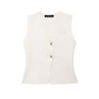 White vest with gold buttons on a white background