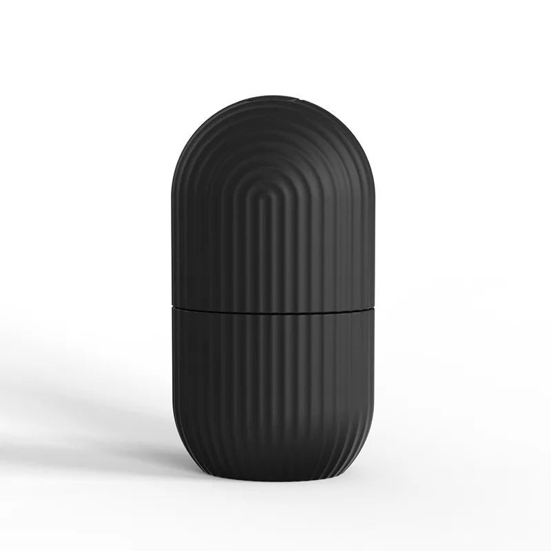 Black cylindrical container with ribbed texture on a white background