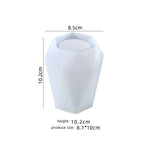 White geometric candle holder with dimensions on a white background