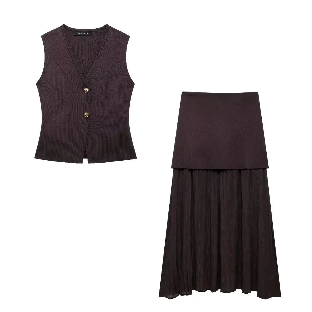 Dark purple vest and skirt set on a white background