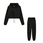 Black hoodie and black pants set on a white background
