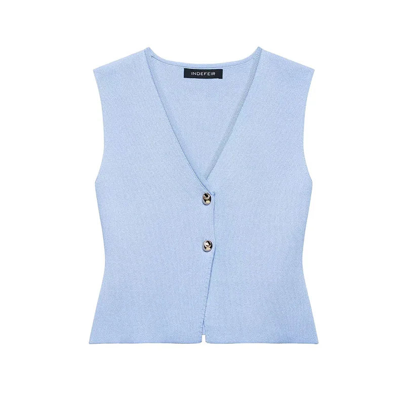 Light blue vest with two buttons on a white background
