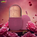 Pink decorative item with a marble-like top on a pink background with roses and rose petals.