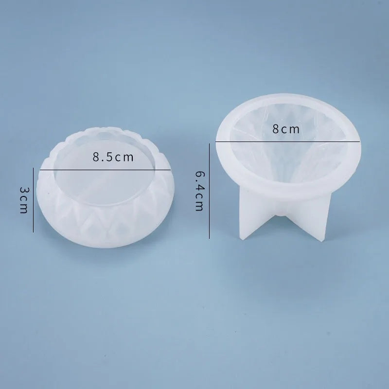 Two silicone molds with measurements on a blue background