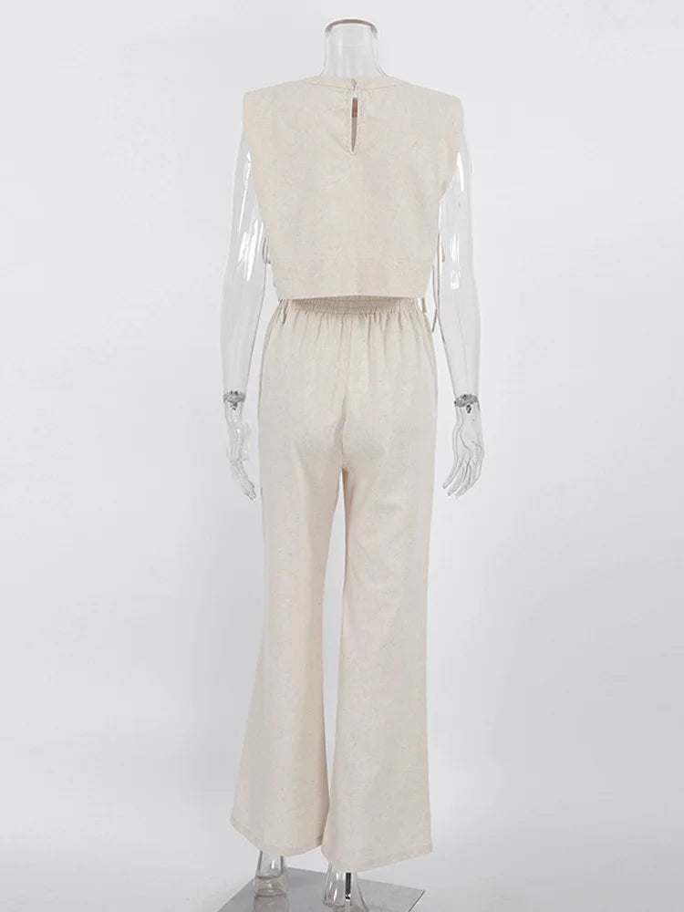 Mannequin wearing a beige sleeveless top and pants on a white background