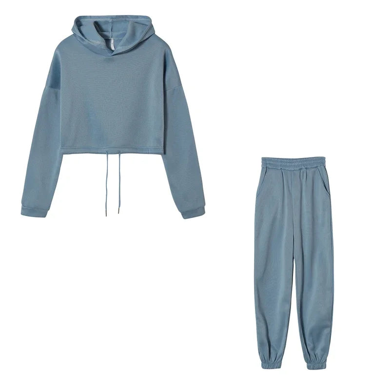 Blue tracksuit with hoodie and jogger pants on a white background
