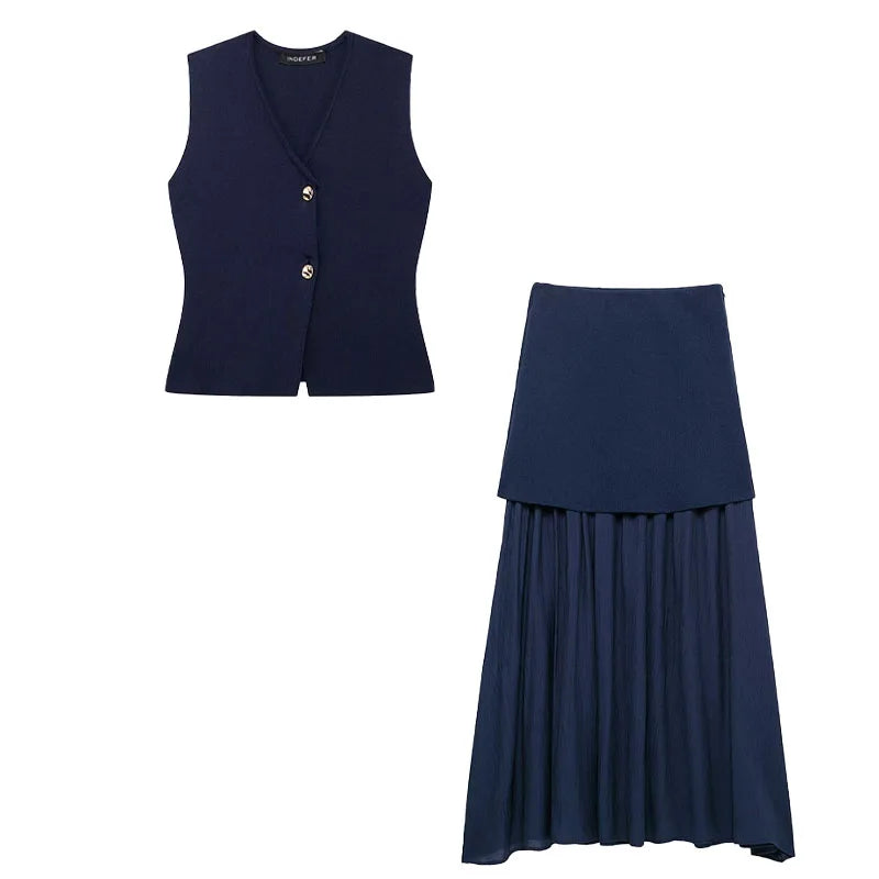 Navy blue vest and pleated skirt set on a white background