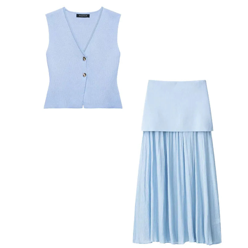 Light blue vest and pleated skirt set on a white background