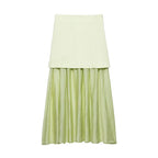 Two-tone skirt with a light green top and sheer green bottom on a white background