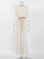 Mannequin wearing a beige sleeveless top and pants set on a white background