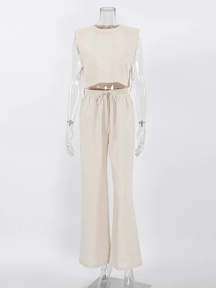Mannequin wearing a beige sleeveless top and pants set on a white background