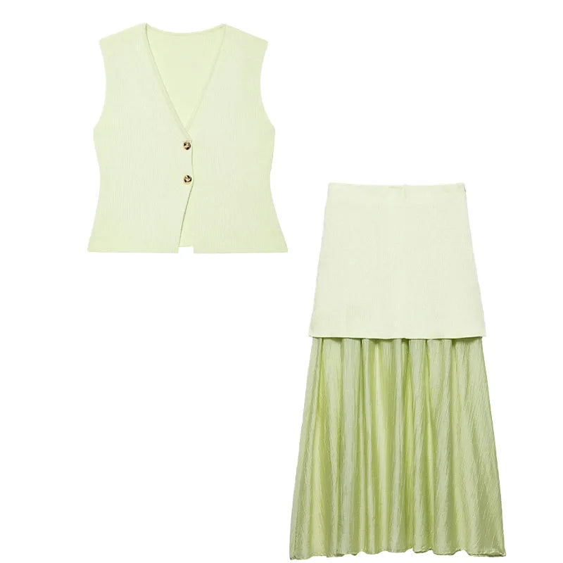 Light green sleeveless top and pleated skirt set on a white background