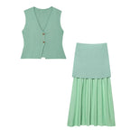 Green vest and skirt set on a white background