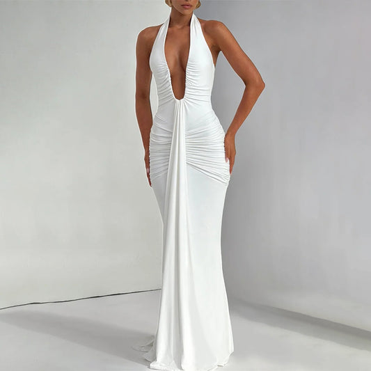 White halter neck gown on a plain background